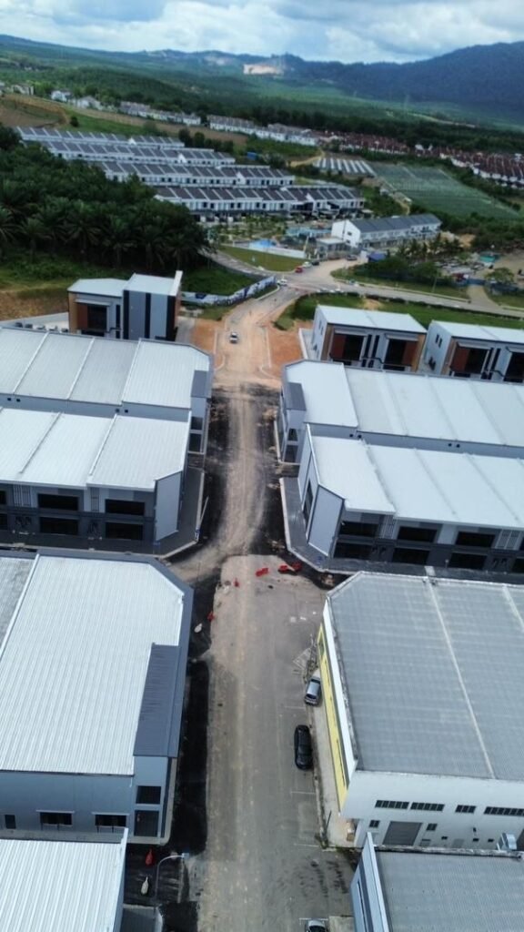 Drone view showing multiple industrial blocks and surrounding area