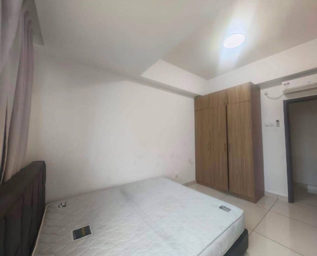 Bedroom with bed, wardrobe, and wall-mounted air conditioner.