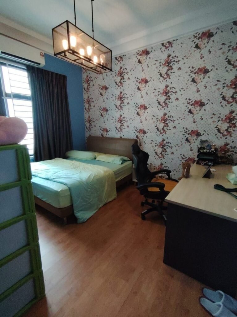 Bedroom with bed, desk, chair, and window.