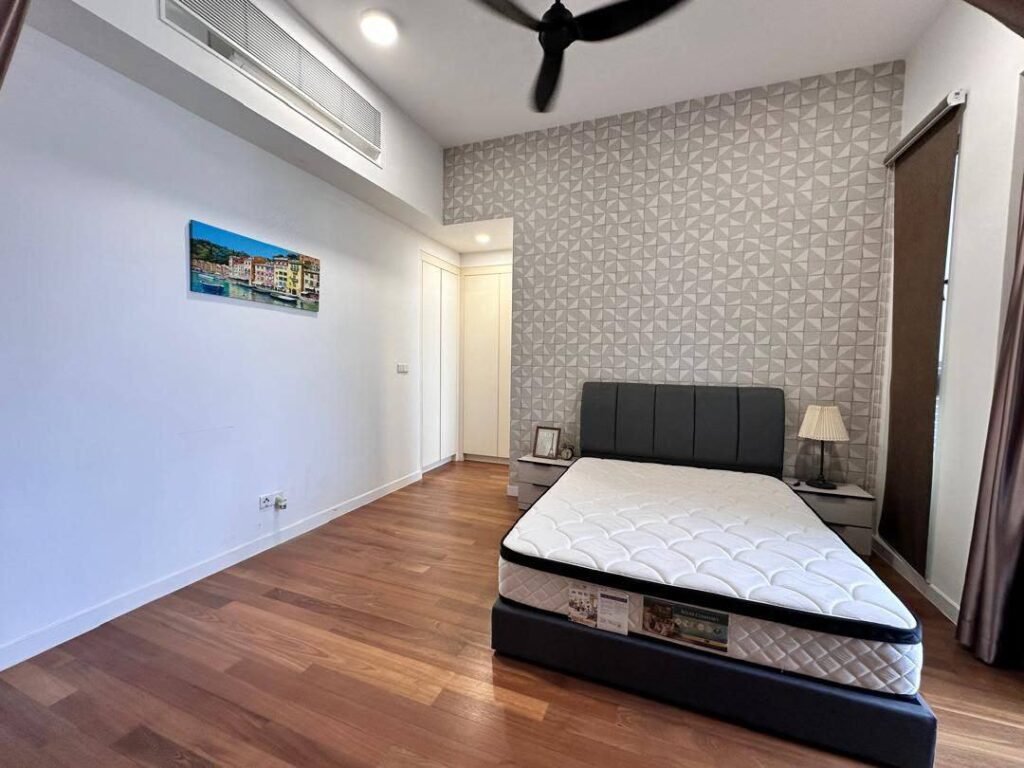 Bedroom with bed, wardrobe area and wood flooring