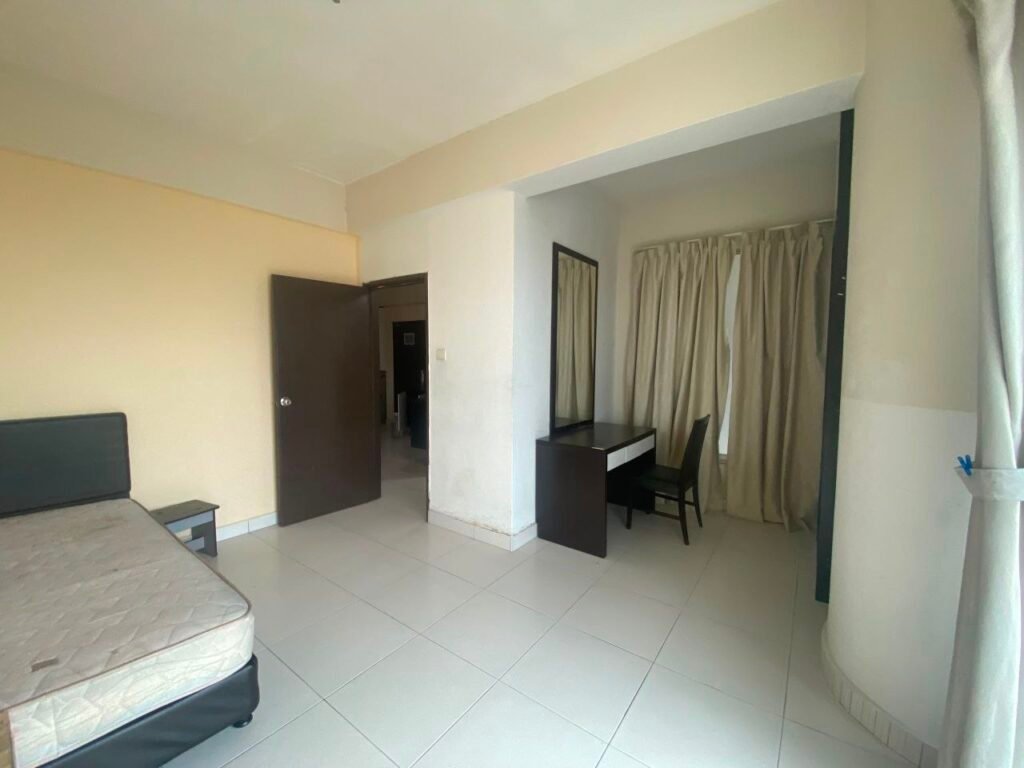 Bedroom with bed, desk nook and curtains