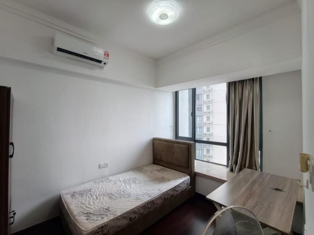 Bedroom with large window and balcony view over the waterfront