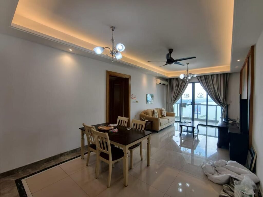 Bedroom with large wardrobe, bed, and wall-mounted fan