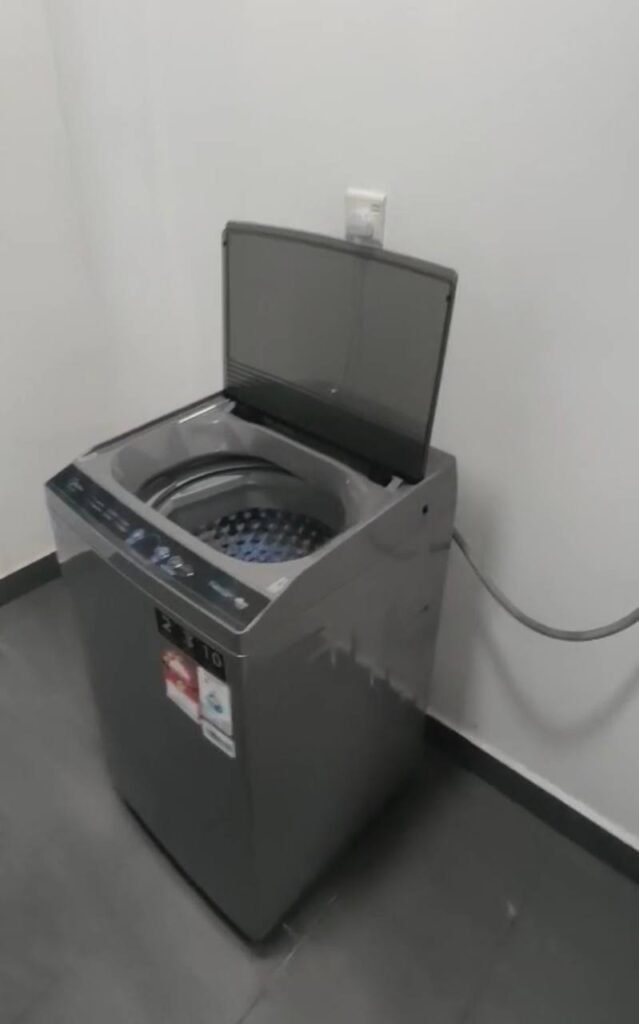 Laundry machine in a utility space.