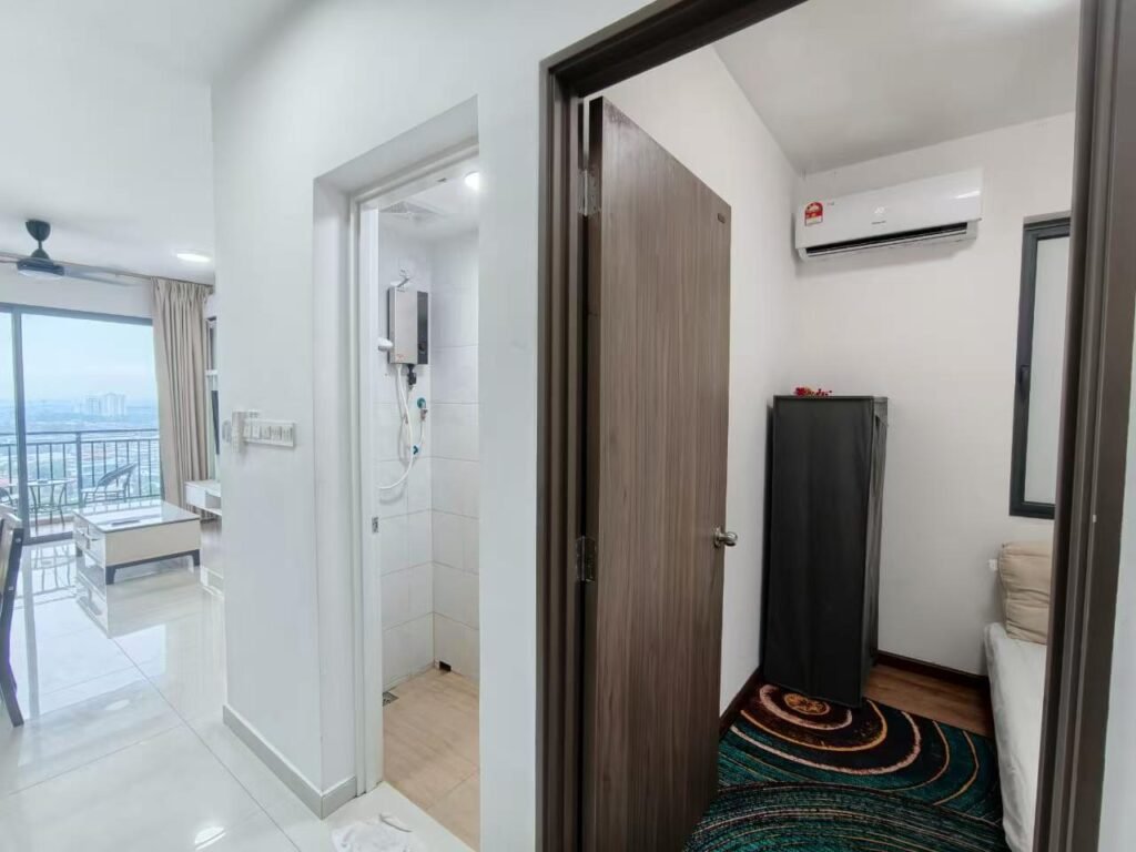 Interior hallway showing access to bathroom and a bedroom with air-conditioner
