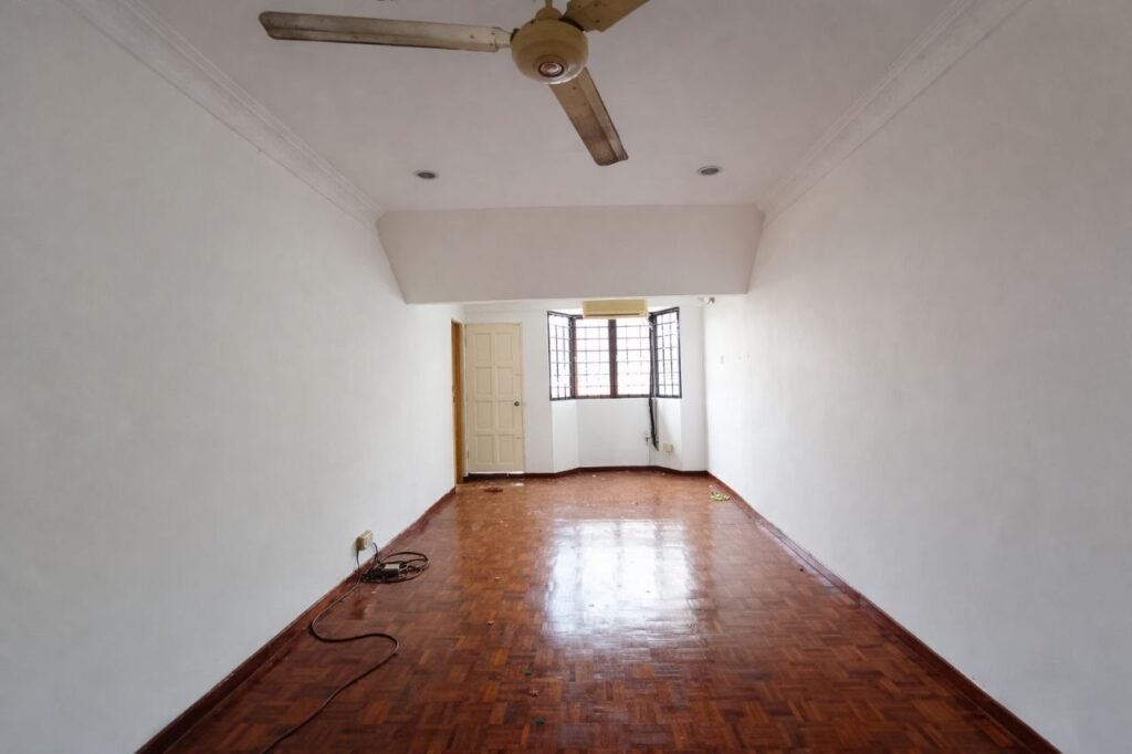 Long bedroom with wooden flooring, ceiling fan, and window