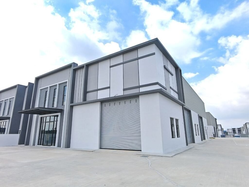 Exterior view of a modern industrial factory building from an angled street view