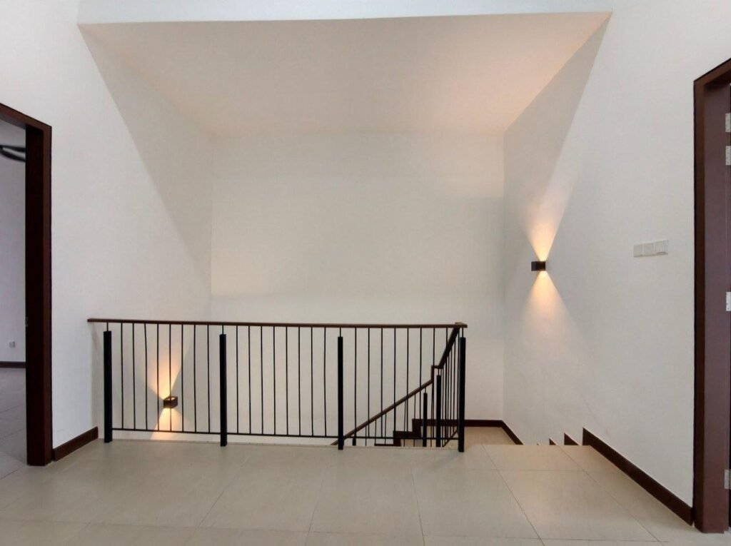 Upper floor landing with railing and stair access.
