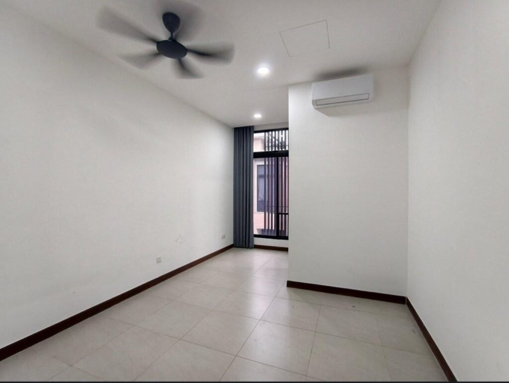Additional bedroom with air-conditioner and window.