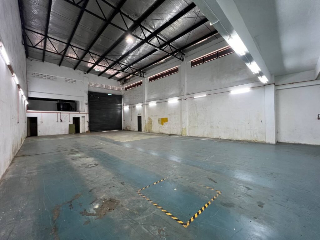 Large open industrial floor area with high ceiling.