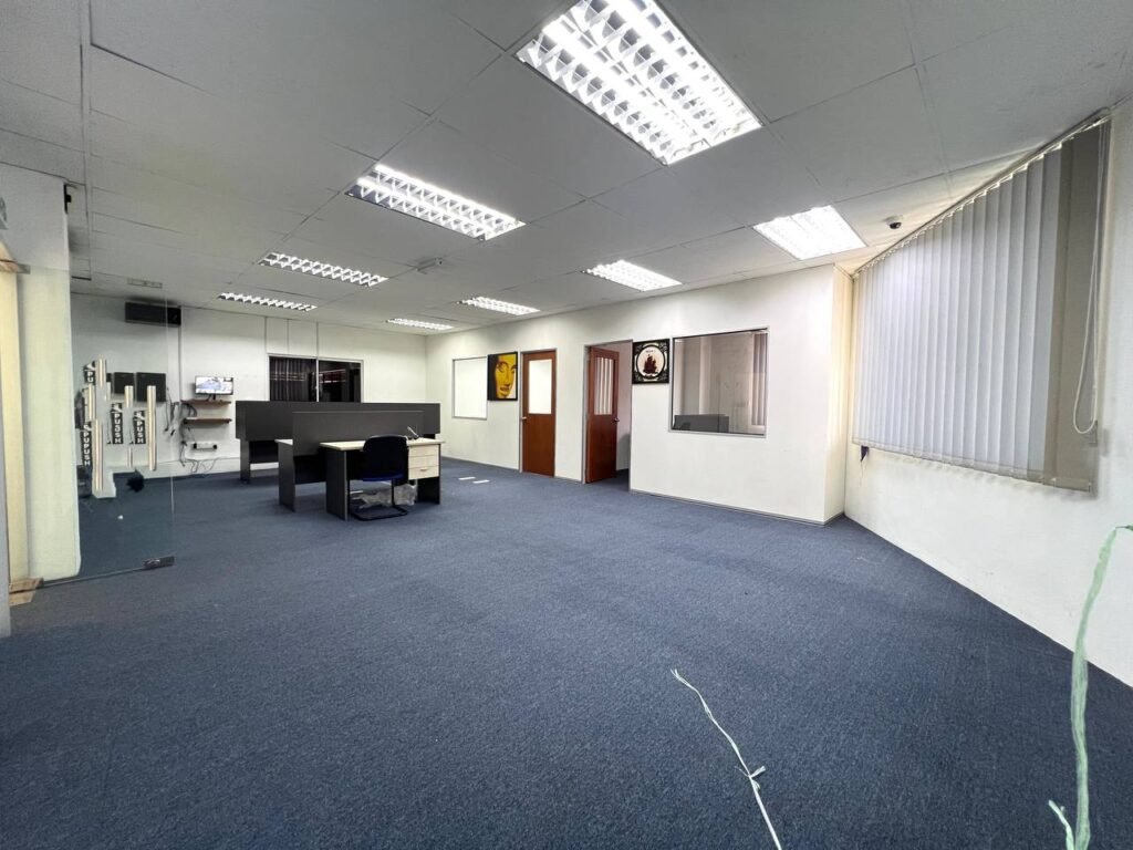 Second office view with desks and partitions.