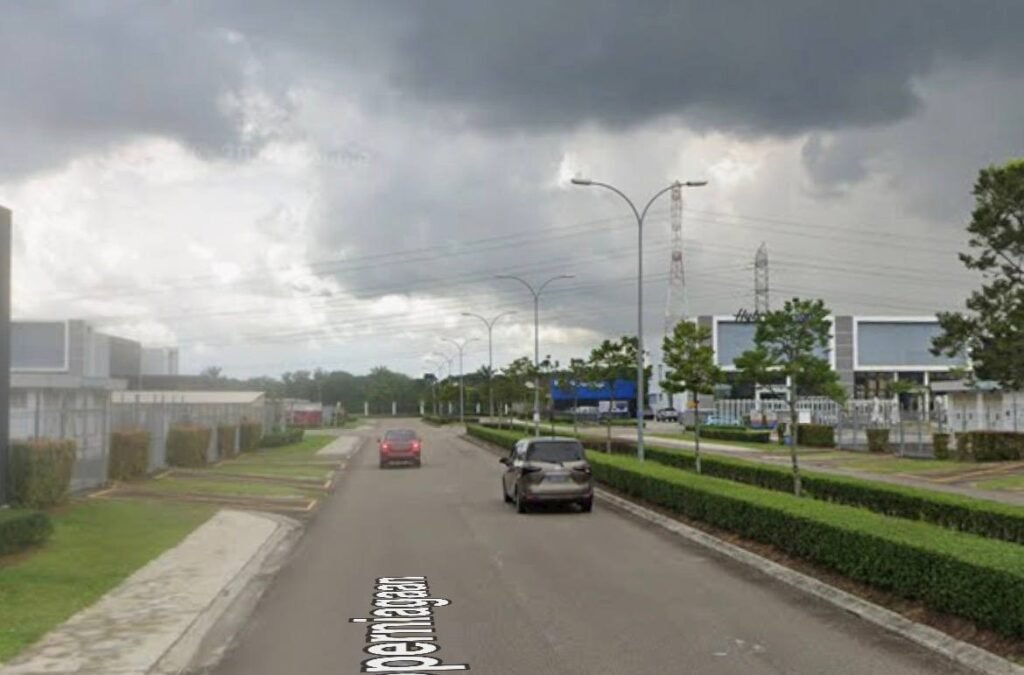 Street view of industrial units and parked cars