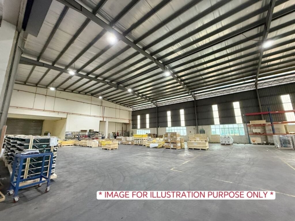 Large factory interior with pallets and materials stored inside