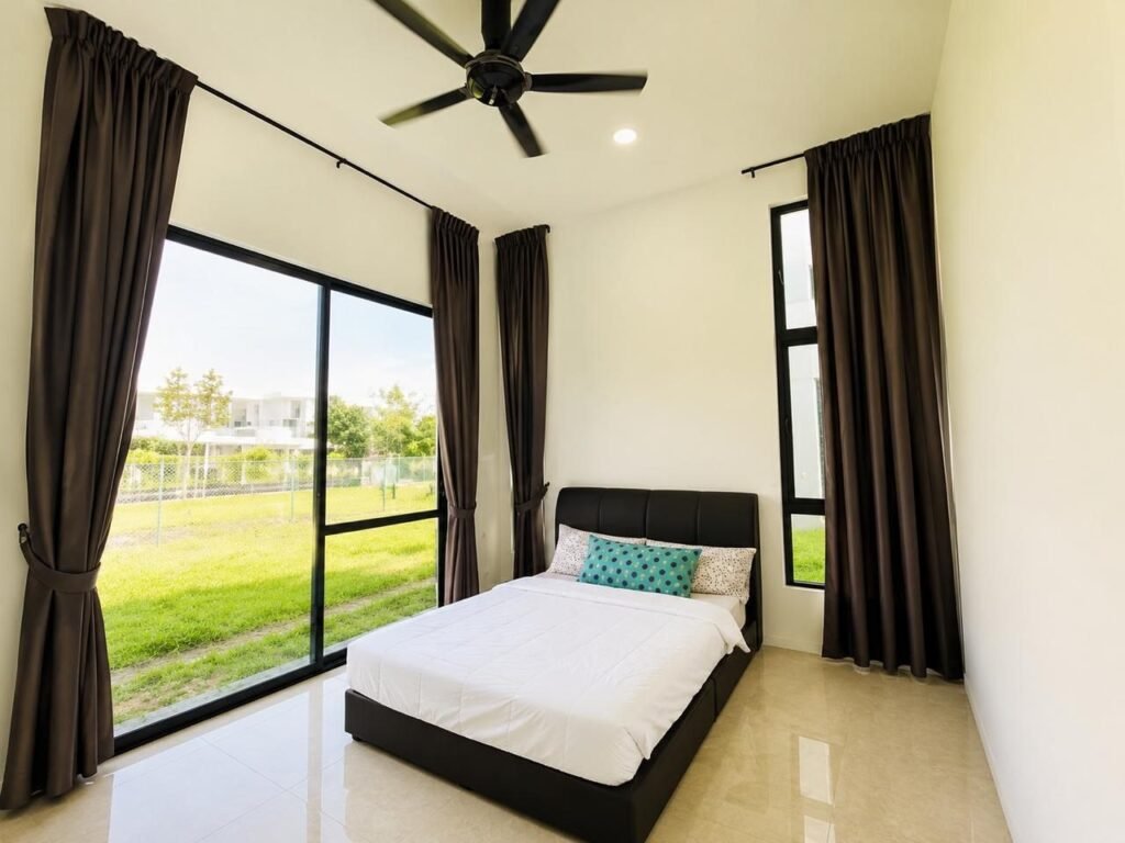 Empty room with wood-look flooring and large window